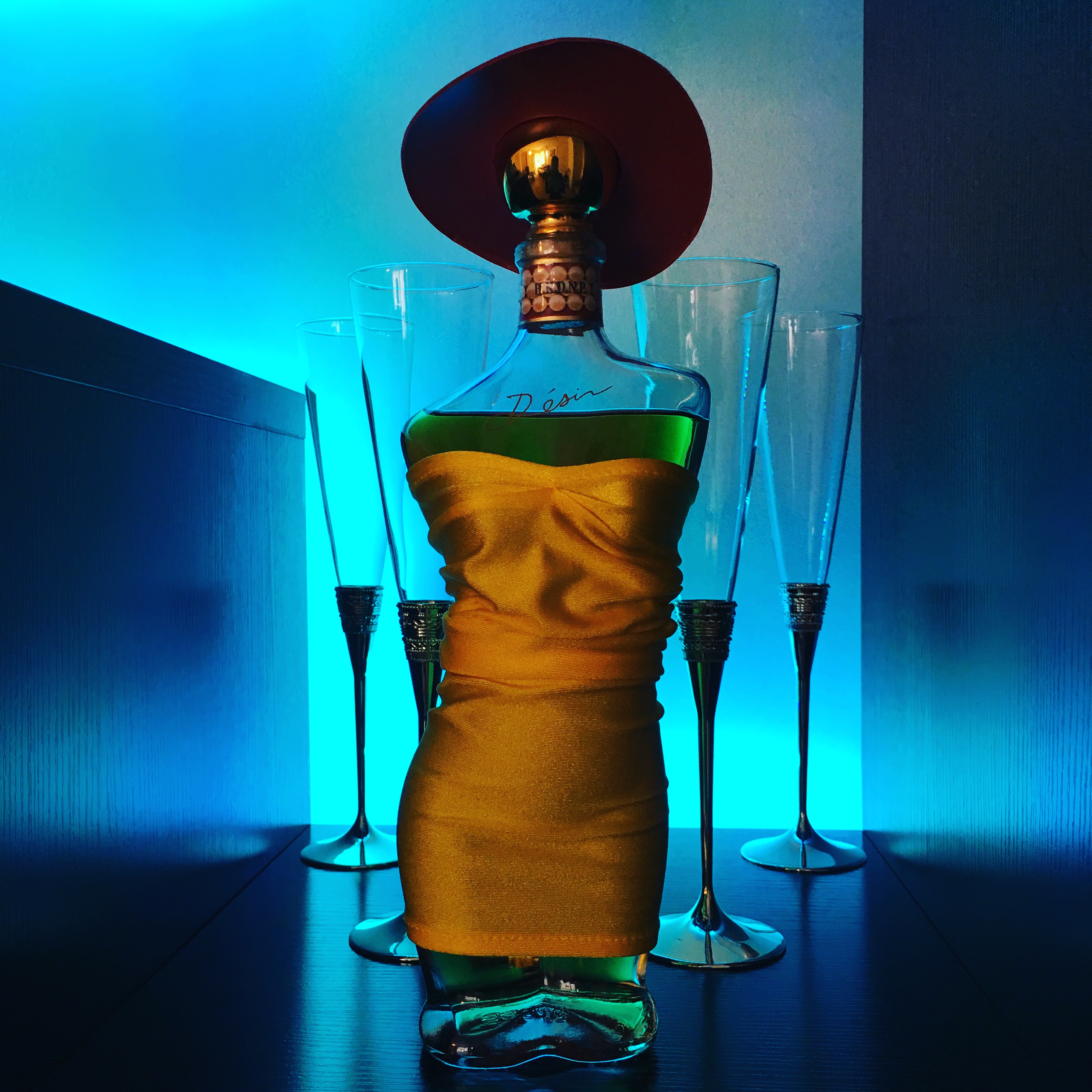 Styled bottle and glasses with cinematic lighting